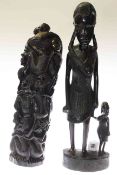 Two tribal carved figure groups,