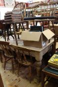 Stripped pine farmhouse kitchen table and seven various kitchen chairs