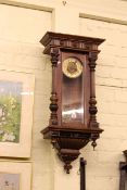 Victorian mahogany cased Vienna wall clock having brass dial