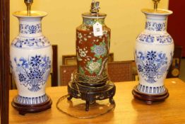 Pair of Oriental pottery table lamps and single lamp with shades