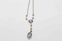 Sapphire and diamond pendant, set with two graduating oval mixed cut sapphire collet set,