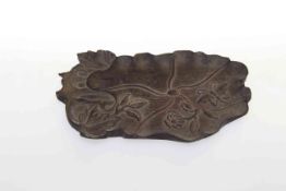 Oriental shaped wood piece carved with butterfly and foliage