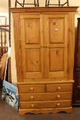 Pine Gents wardrobe having two panelled doors above two short and two long drawers