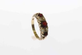Gold ring set with seed pearls and garnets,