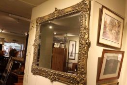 Ornate gilt framed bevelled wall mirror,