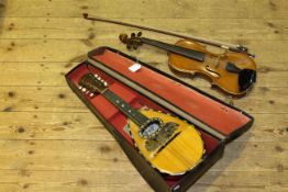 Violin and bow and cased mandolin