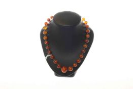 Amber coloured bead necklace, 19.9 grams, 42.
