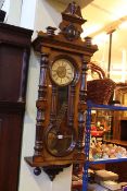 Victorian walnut cased Vienna wall clock having enamelled and gilt floral decorated dial