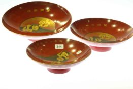 Graduated set of three vintage Chinese red lacquer and gilded bowls,