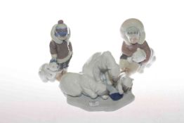 Lladro polar bear group and two Eskimo figures,