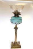 Brass corinthian column oil lamp with blue glass and floral painted glass reservoir and etched