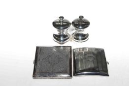 Two silver cigarette cases and a pair of silver 'Peter Piper' pepper mills (4)