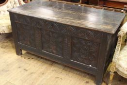 Antique carved oak triple panel front coffer,