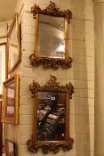 Pair ornate gilt framed bevelled wall mirrors