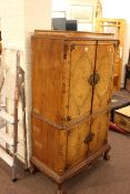 Burr walnut four door cocktail cabinet on ball and claw legs