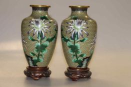 Pair of Japanese cloisonne vases on wooden stands, overall 23.