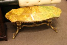Oval shaped onyx and brass coffee table