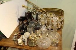 Brass log bin, fire irons, glass decanters and lustre drop candelabra, elephant ornaments,