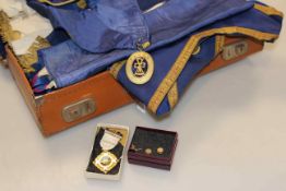 Case of Masonic regalia including studs (probably gold) and tie pin