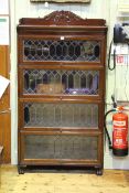 Mahogany Globe Wernicke style four height stacking bookcase with leaded glazed doors, 86.