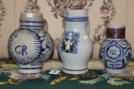 Three Westerwald stoneware jugs, largest 21.
