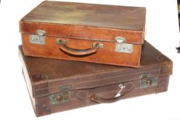 Two vintage leather suitcases