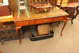 Three drawer writing table on cabriole legs