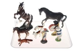 Collection of Beswick including pig band figures, hounds,