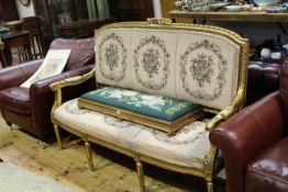 French gilt open arm settee in tapestry fabric