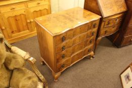 Walnut shaped front chest of four drawers on cabriole legs