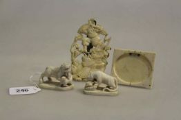 Two small ivory lion carvings,