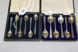 Two cased sets of six silver teaspoons