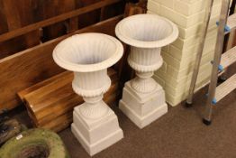 Pair cast campana style garden urns and stands