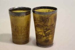 Two antique horn beakers engraved with coaching and hunting scenes,