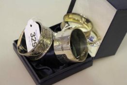 Three silver napkin rings and two silver collars (5) 2.