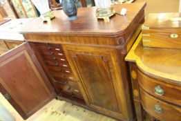 19th Century mahogany stationery or collectors cabinet having two panelled doors enclosing twenty