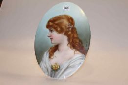 KPM porcelain oval plaque, painted with a portrait of a young lady, signed A.E.M., 30.