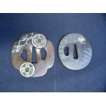 TWO JAPANESE SWORD GUARDS (TSUBA) of bronze, the first with kozuka hitsu-ana, decorated on each face