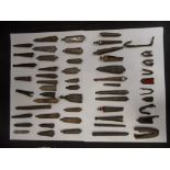 A LARGE COLLECTION OF IRON SCABBARD CHAPES, MEDIEVAL, STUART, AND TUDOR with a number of lead-
