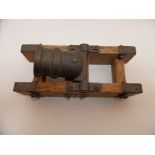 A BRONZE MODEL MORTAR, 20TH CENTURY formed in four stages, with raised astragal mouldings (the