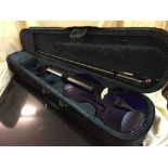 A cased Japanese violin and a purple Fantasia violin with bow in case