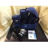 A basket of Minolta Dynax 505si camera in bag and a Minolta Dynax 800si camera in bag with lens and