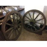 A pair of wooden cart wheels