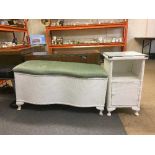 A white loom blanket box with matching bedside stand