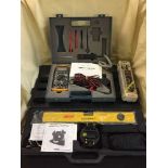 A cased laser level with stand,