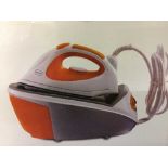 A boxed steam iron