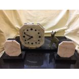 A three piece marble art deco clock with garniture