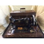 A vintage Jones Federation Family sewing machine and a smoker's stand