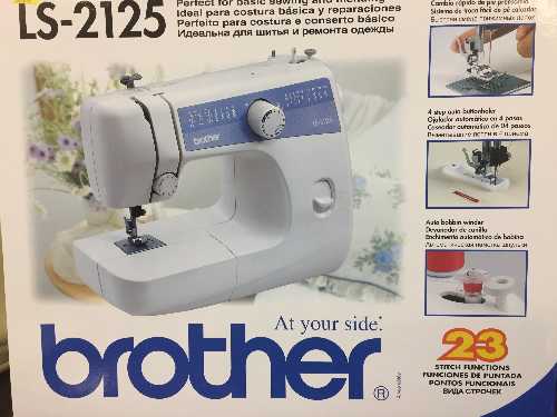 A boxed Brother LS-2125 electric sewing machine and a Professional dream steam cleaner