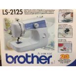 A boxed Brother LS-2125 electric sewing machine and a Professional dream steam cleaner